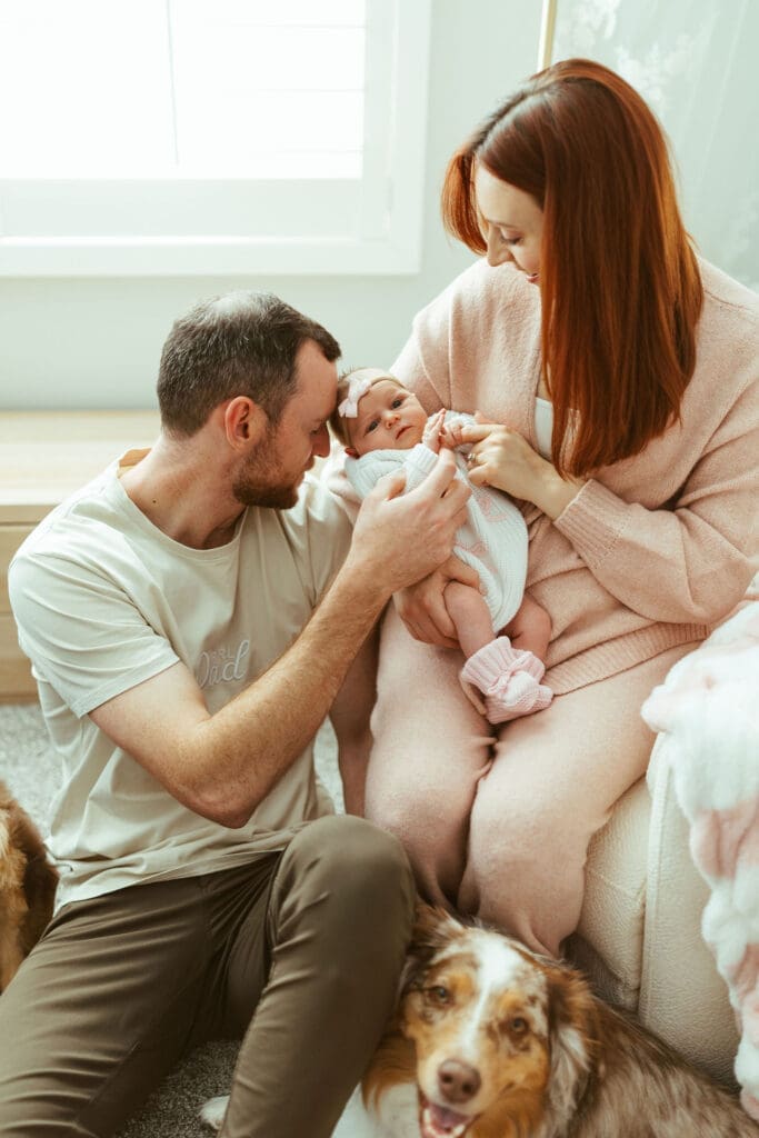 Newborn baby girl sleeping peacefully in blush pink nursery during in-home newborn photography session in Paradise Valley Arizona