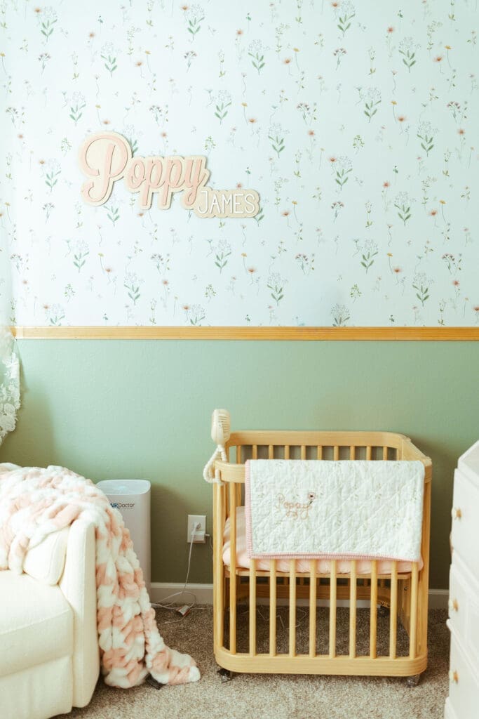 Arizona lifestyle newborn photographer serving Scottsdale, Paradise Valley, Arcadia, Silverleaf, and DC Ranch , Scottsdale newborn photographer capturing newborn baby girl in softly lit nursery with blush accents and organic textures