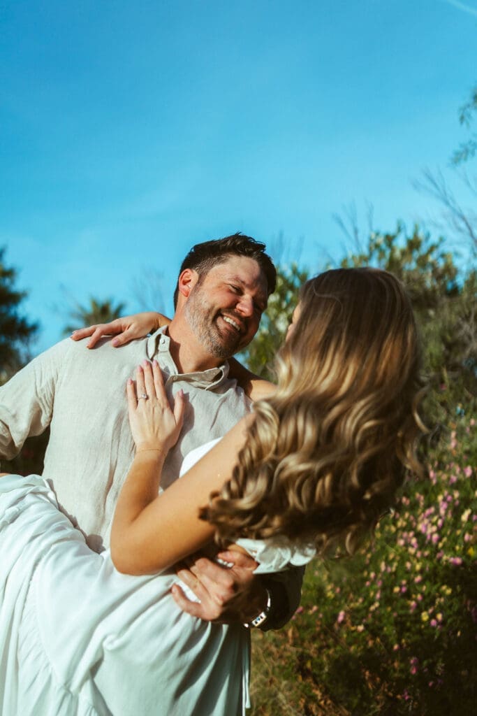 Golden hour engagement session at The Meadow in Mesa Arizona with natural candid couples photography and romantic posing