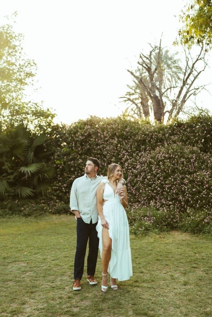 Romantic couples photography session near Phoenix Arizona with emotional engagement portraits during sunset at The Meadow