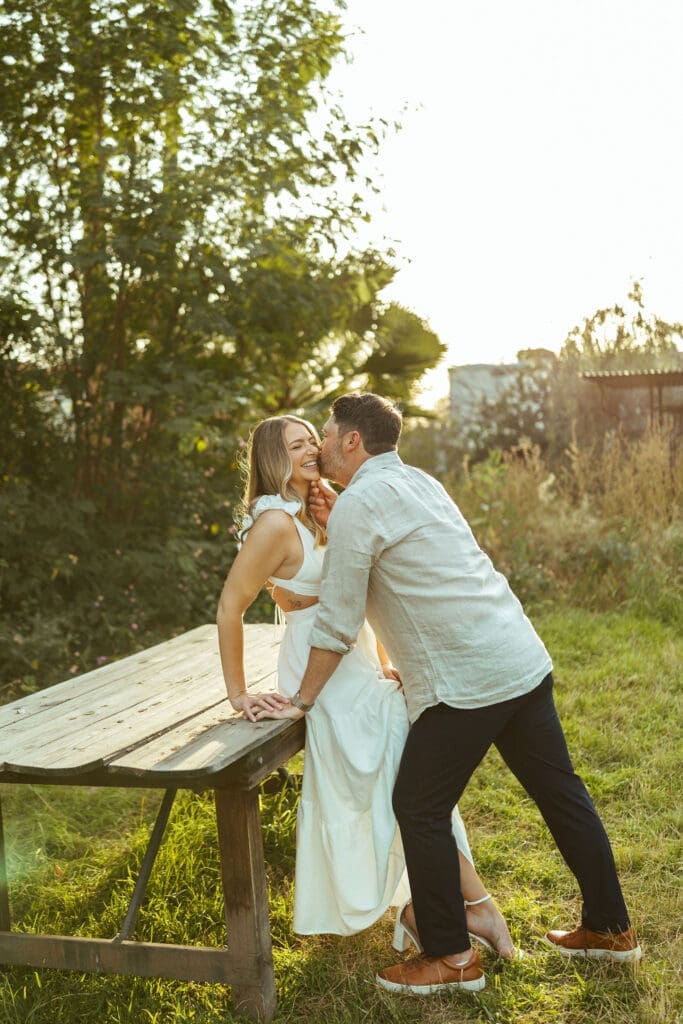 Arizona couples photographer documenting romantic engagement photos with natural movement and timeless posing at The Meadow