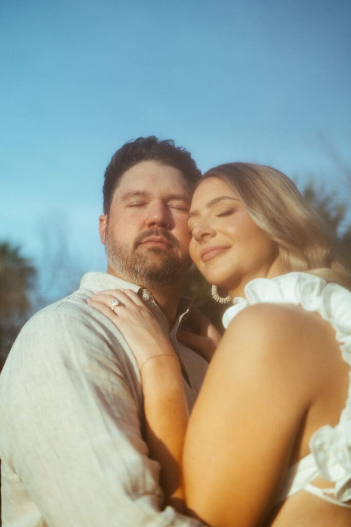 Dreamy engagement photography in Mesa Arizona with cinematic lighting and lush green outdoor scenery near Scottsdale
