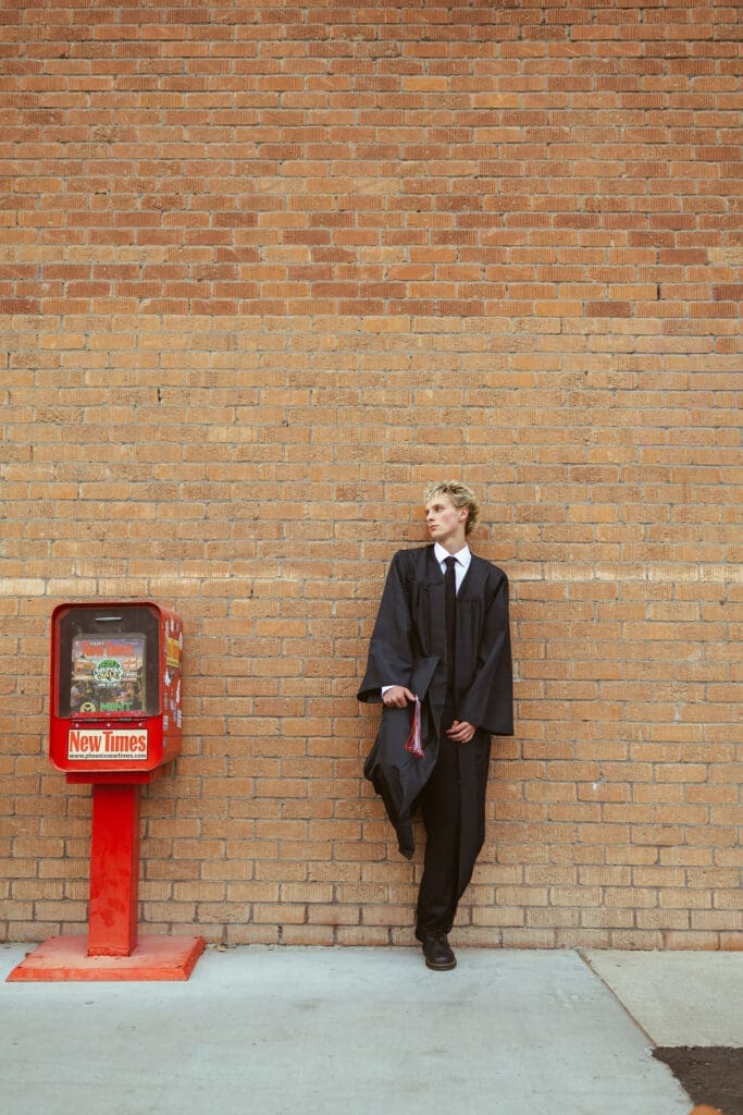 Gilbert Arizona senior photography session with cool modern senior boy posing downtown