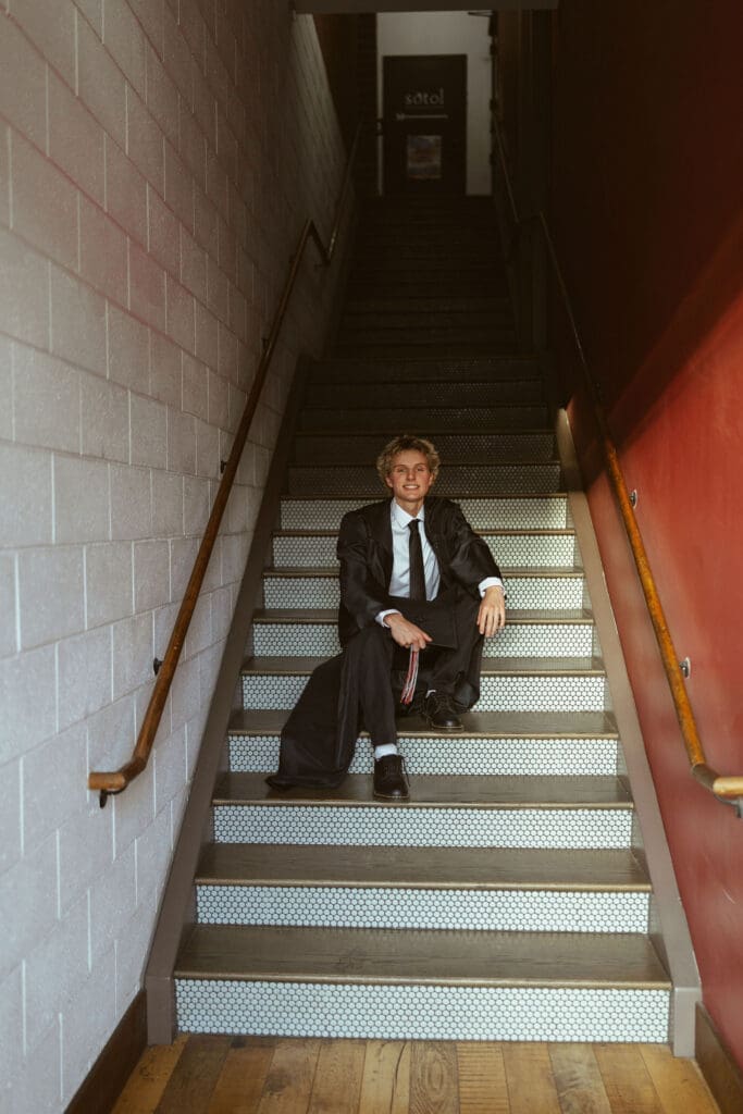 Modern male senior photos in Downtown Gilbert Arizona with natural candid posing