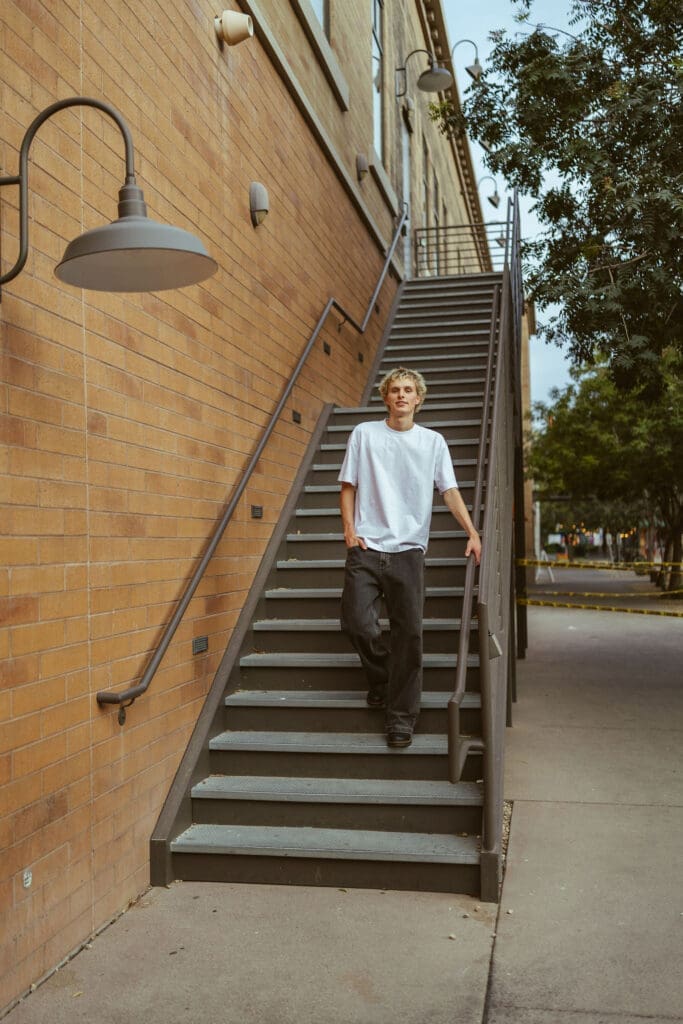 Senior guy photos in Downtown Gilbert with natural movement and editorial posing