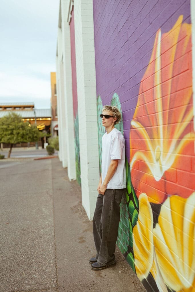 Downtown Gilbert Arizona senior photo location with urban murals and modern textures