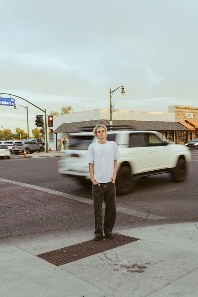 Senior guy photos in Downtown Gilbert with natural movement and editorial posing