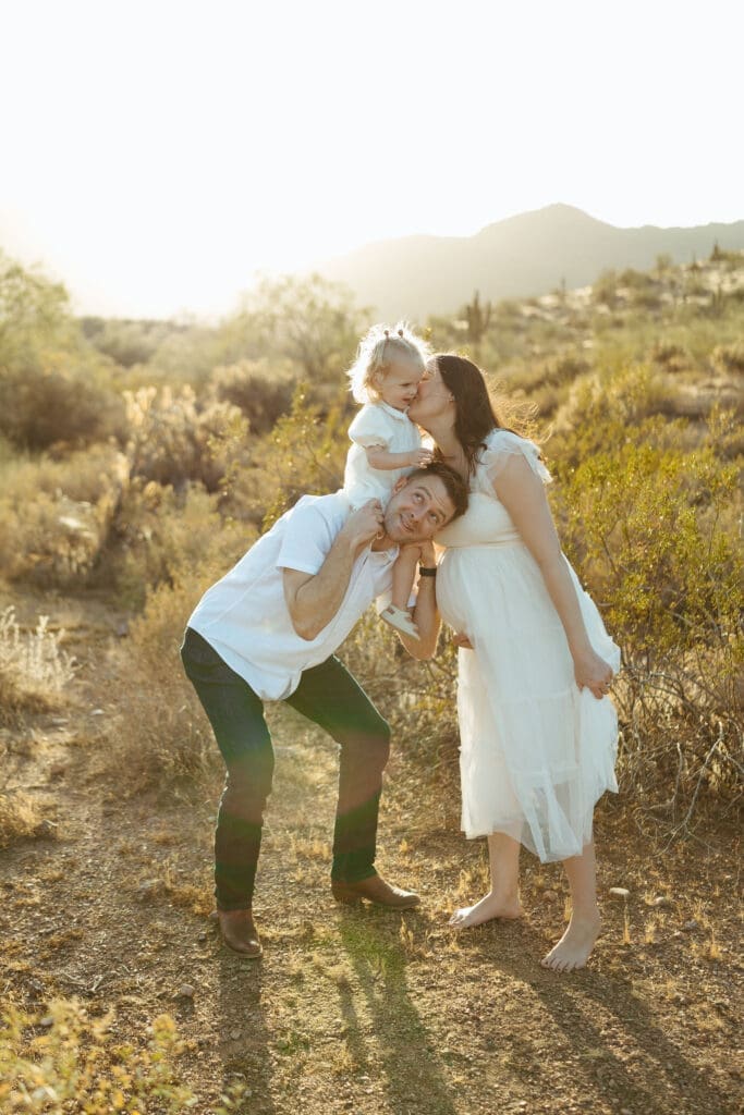 Queen Creek maternity photographer capturing playful family maternity portraits with toddler before welcoming new baby