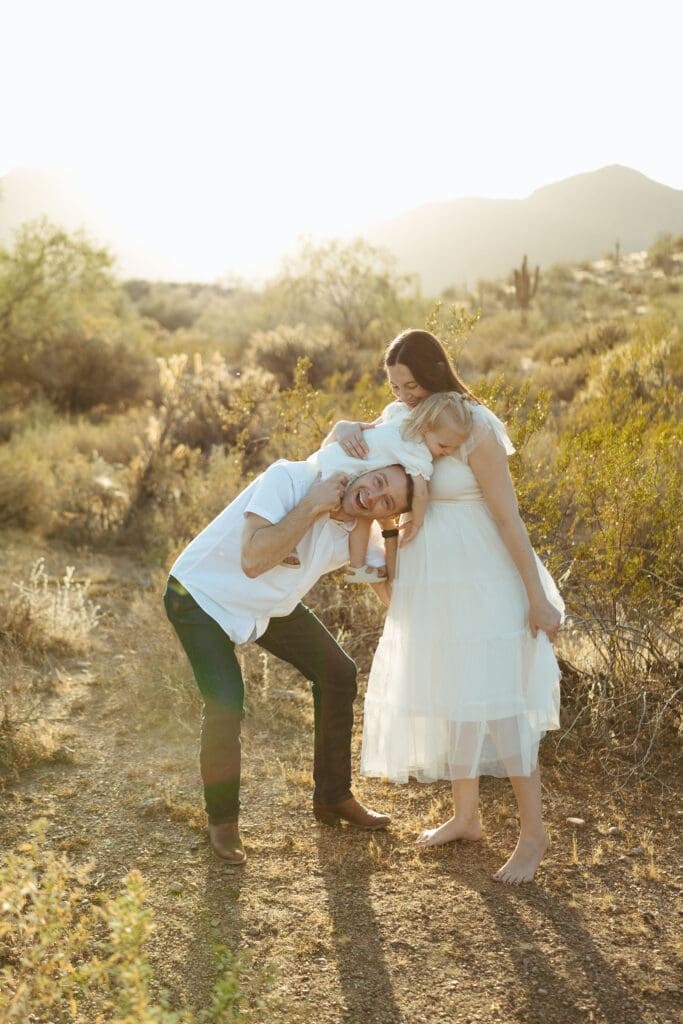 Mesa maternity photography session featuring growing family celebrating pregnancy at Phon D Sutton Recreation Area