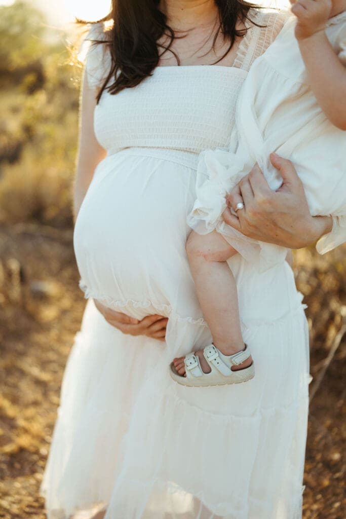 Paradise Valley maternity photographer capturing candid family moments and pregnancy portraits in Arizona desert landscape