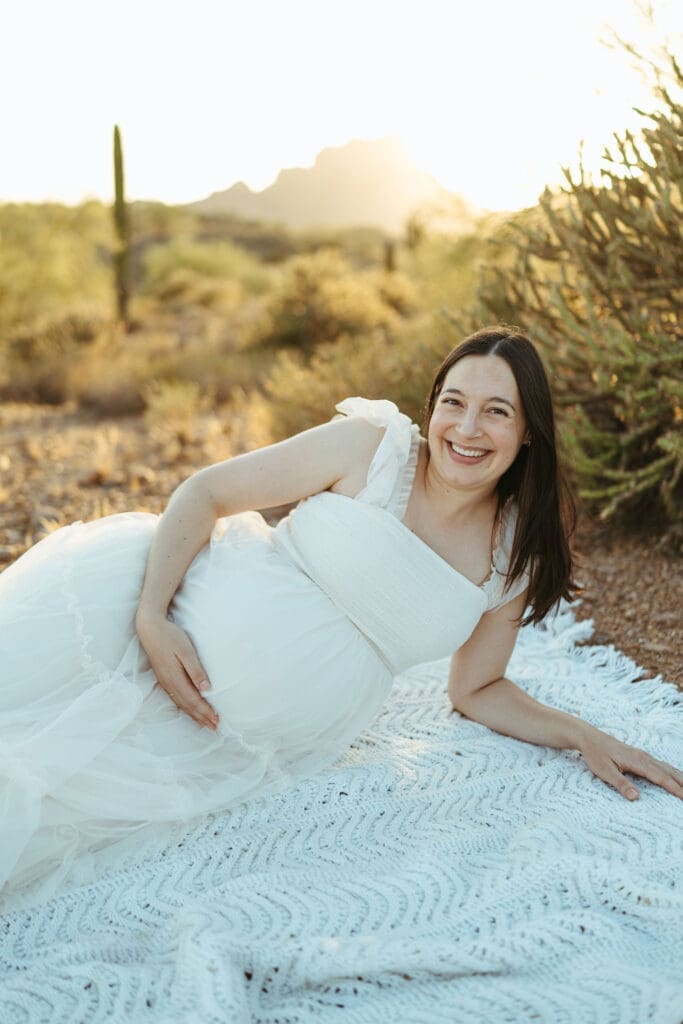 Queen Creek maternity photographer capturing natural family connection during outdoor maternity session near Phoenix Arizona