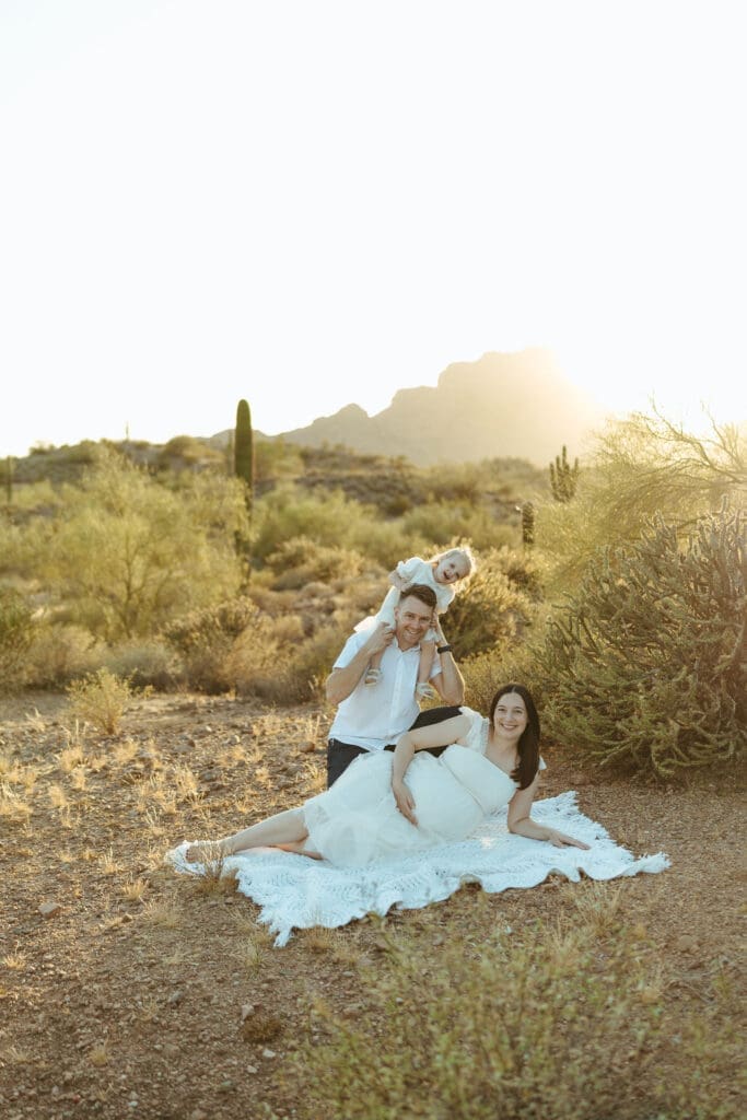 Phoenix maternity photographer creating timeless maternity portraits with mountain views and golden desert light