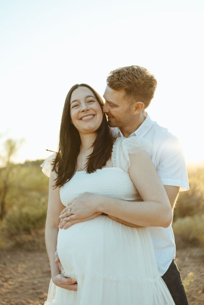 Paradise Valley maternity photography featuring expecting parents celebrating pregnancy in Sonoran Desert landscape near Mesa Arizona