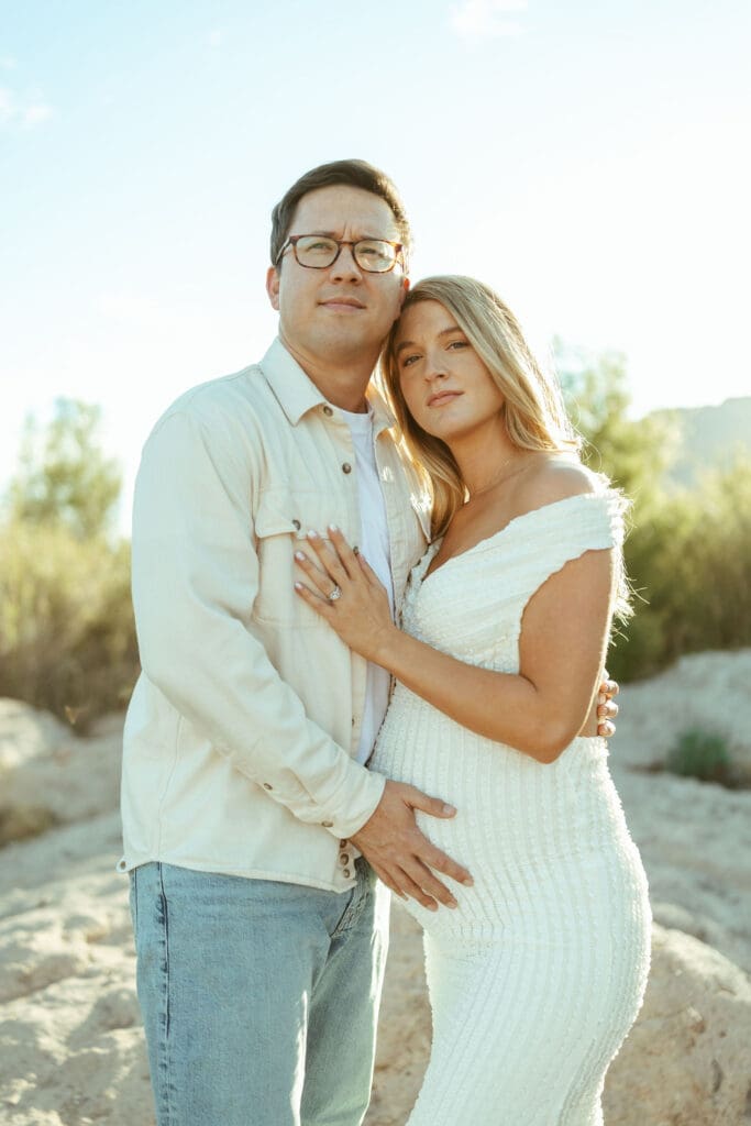 Salt River maternity photo session at Phon D Sutton Recreation Area in Mesa Arizona with glowing sunset light and romantic neutral outfits.