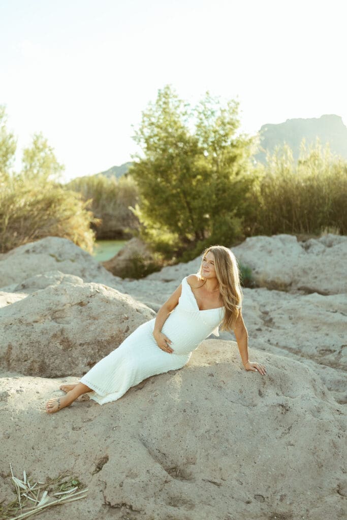 Salt River maternity photo session at Phon D Sutton Recreation Area in Mesa Arizona with glowing sunset light and romantic neutral outfits.