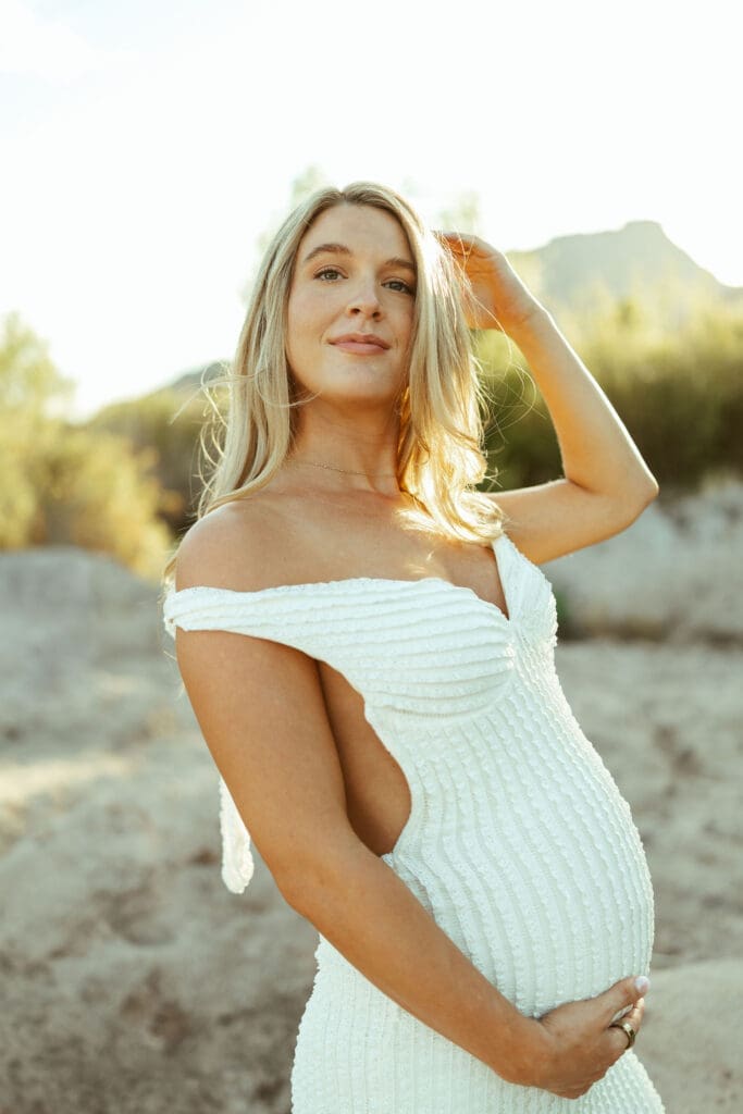 Salt River maternity photo session at Phon D Sutton Recreation Area in Mesa Arizona with glowing sunset light and romantic neutral outfits.