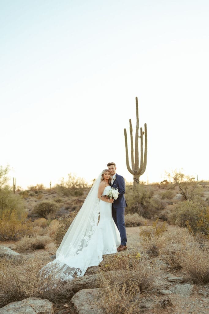 Bride and groom embracing during sunset portraits at The Paseo Arizona