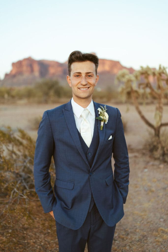 Arizona groom posing outdoors at The Paseo wedding venue