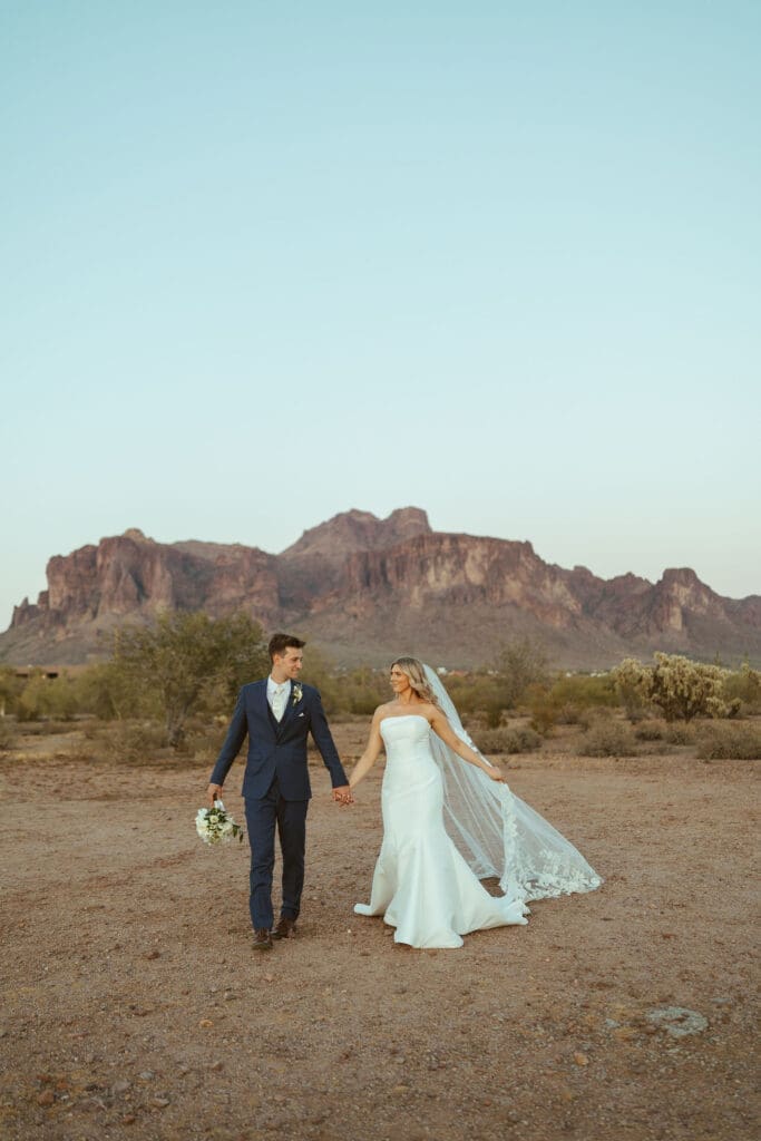 Bride and groom walking together during golden hour at The Paseo Arizona