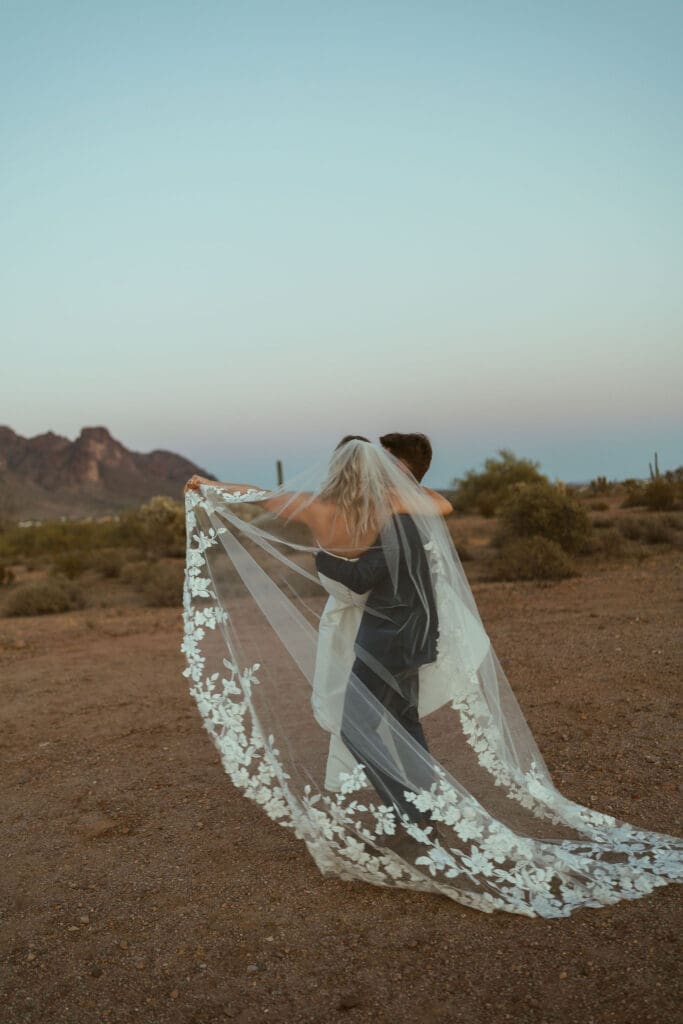 Bride and groom embracing during sunset portraits at The Paseo Arizona