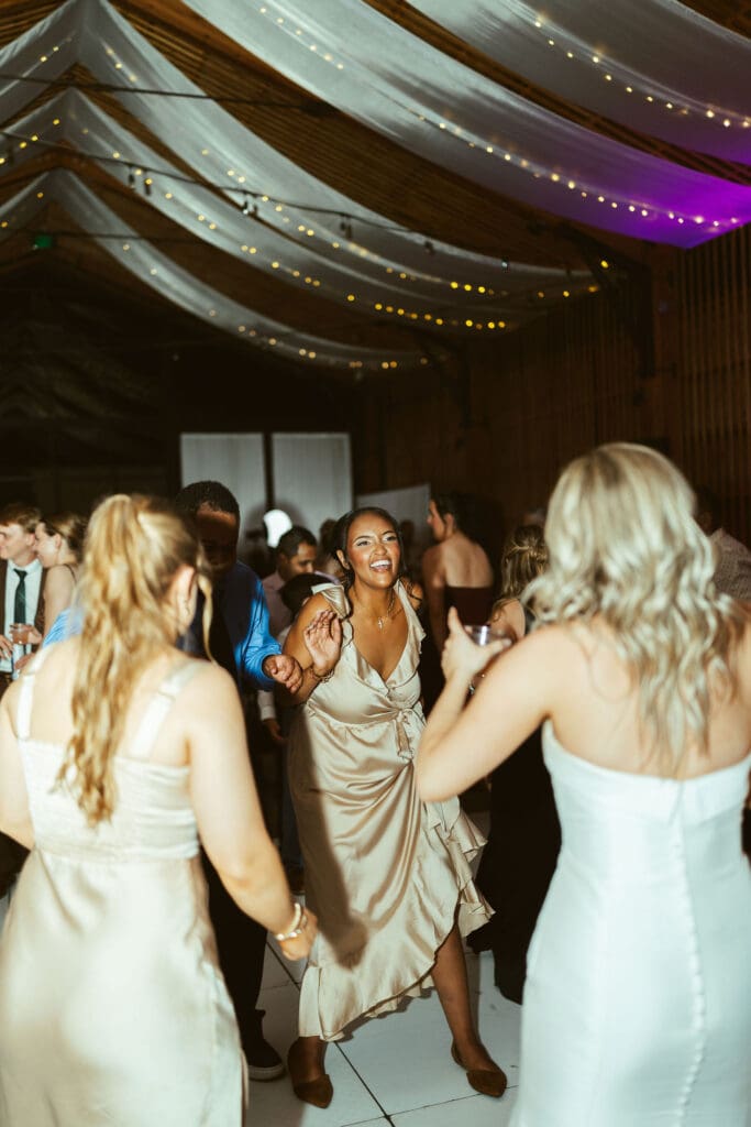 Bride and groom celebrating with guests during Arizona wedding reception at The Paseo