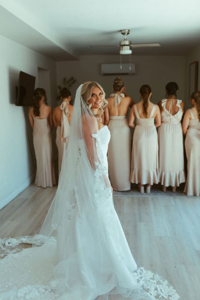 Bride and bridesmaids celebrating together before ceremony at The Paseo
