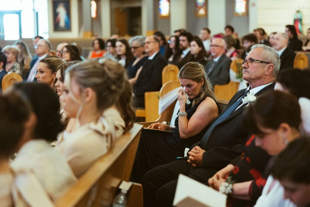 Traditional Catholic wedding mass in Scottsdale Arizona with family and bridal party, mom crying