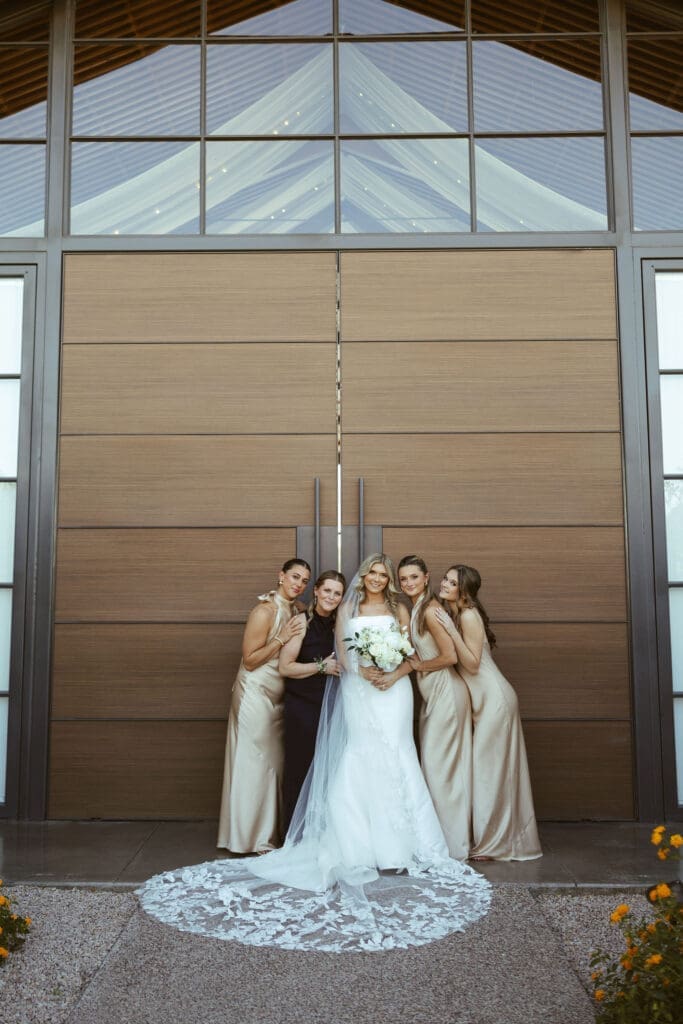 Bride and groom posing with family members during wedding portraits at The Paseo Arizona