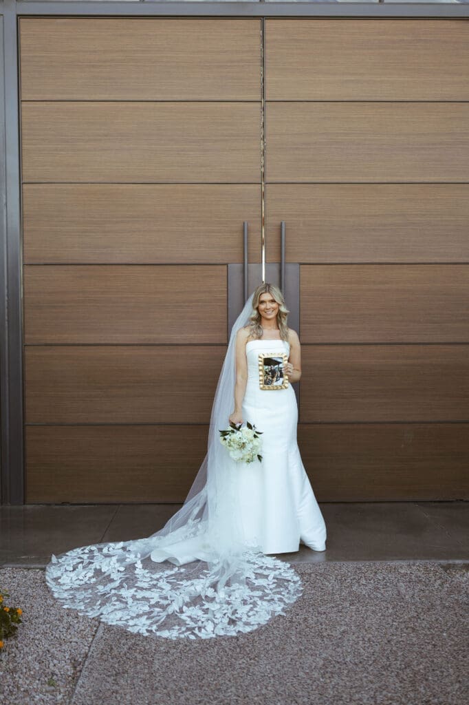 Bride standing in front of doors at the Paseo on wedding day