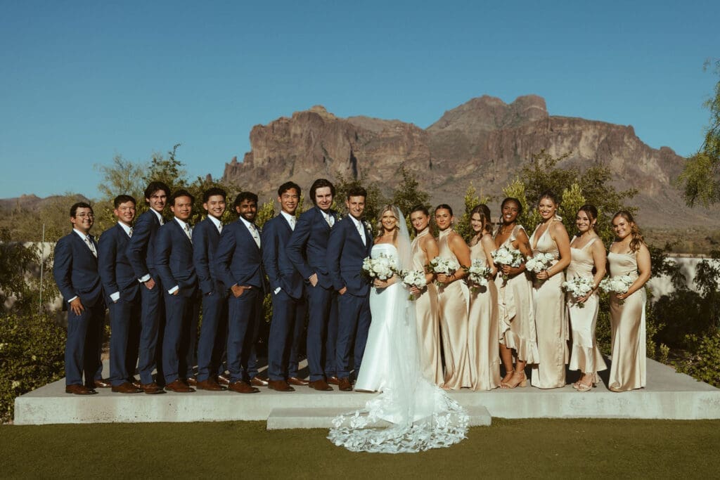 Bride and groom posing with family at The Paseo wedding venue in Apache Junction Arizona
