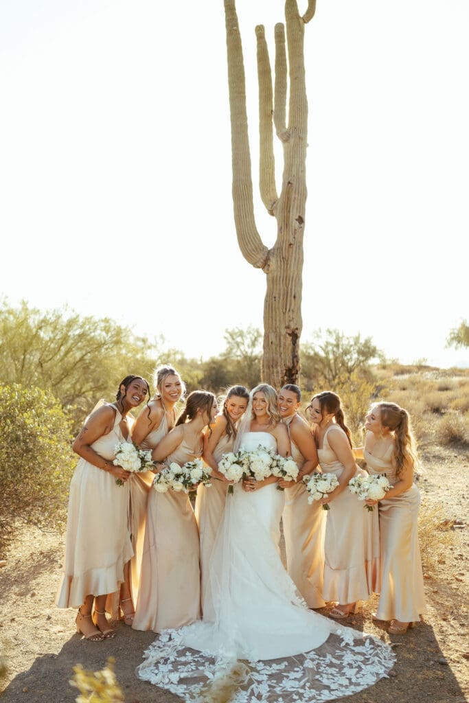 Romantic wedding party portraits with saguaros and mountain scenery at The Paseo