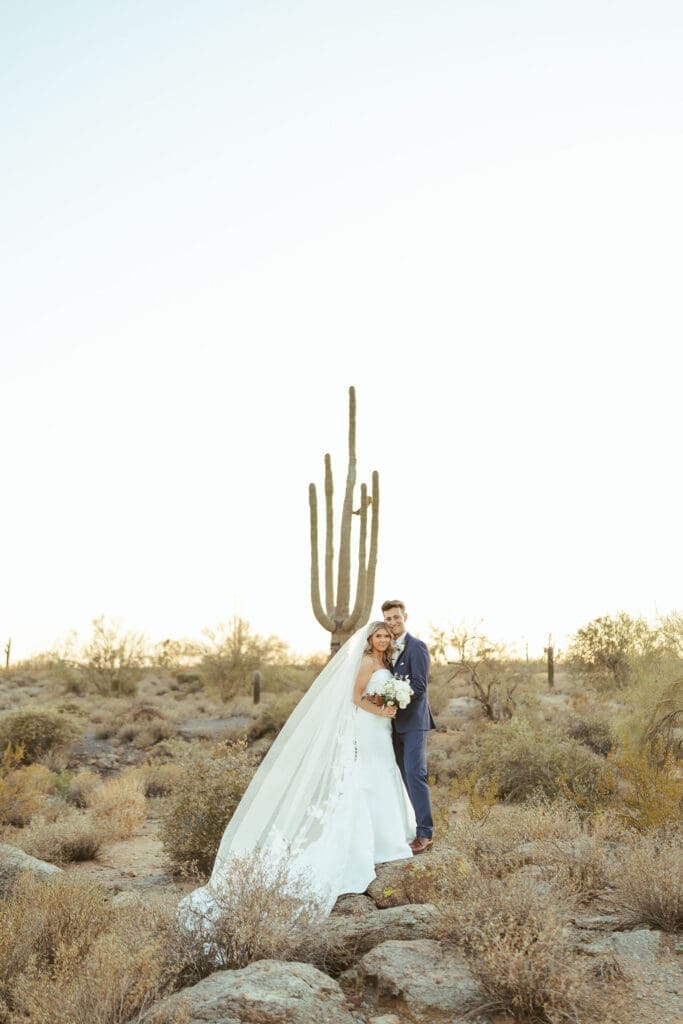 Bride and groom posing at The Paseo wedding venue in Apache Junction Arizona