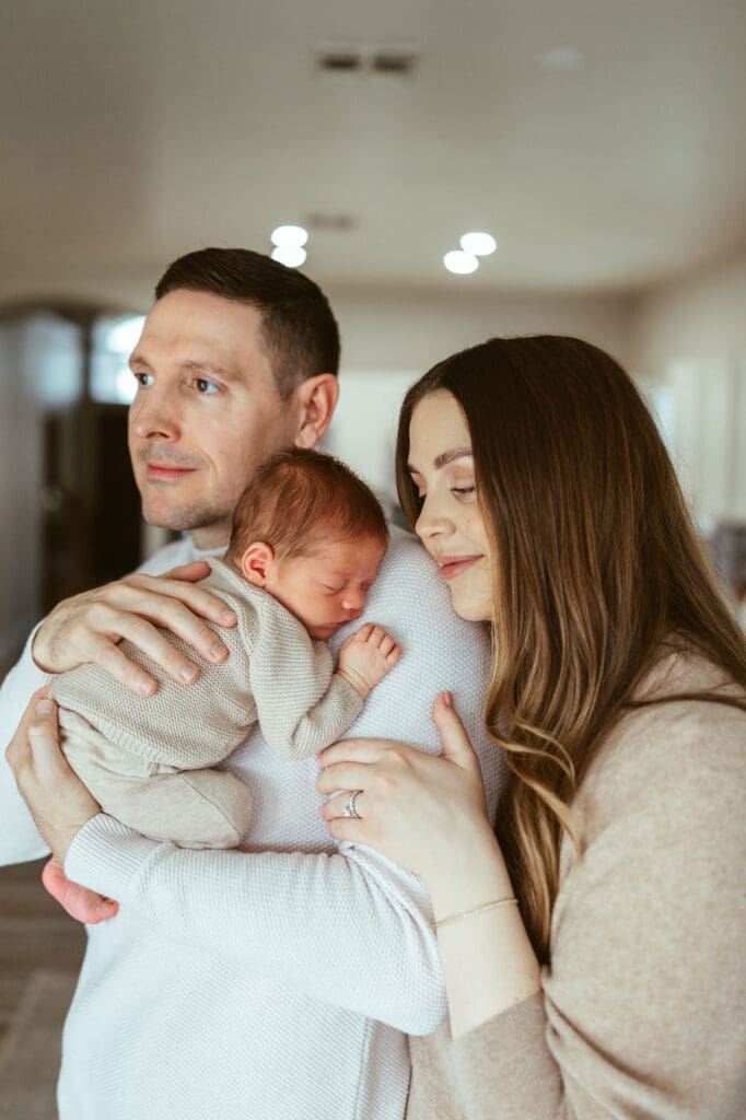 Phoenix area newborn photographer capturing baby-led lifestyle newborn photography with warm neutral tones and natural window light in Scottsdale Arizona
