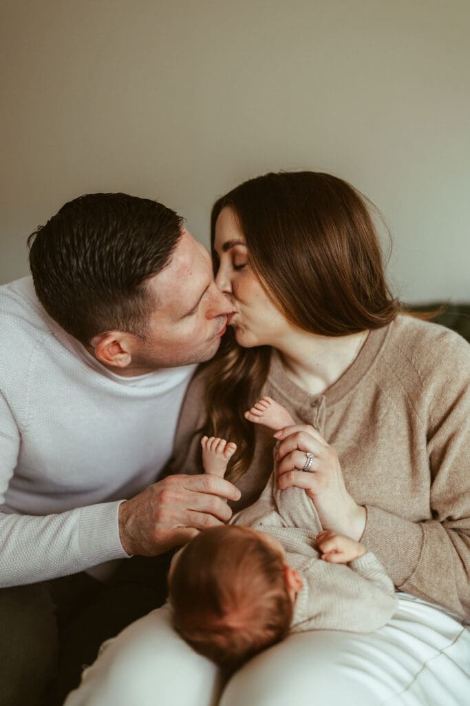 Scottsdale Arizona newborn photographer capturing sleepy newborn baby in neutral knit outfit during cozy in-home lifestyle newborn photography session near Phoenix and Paradise Valley