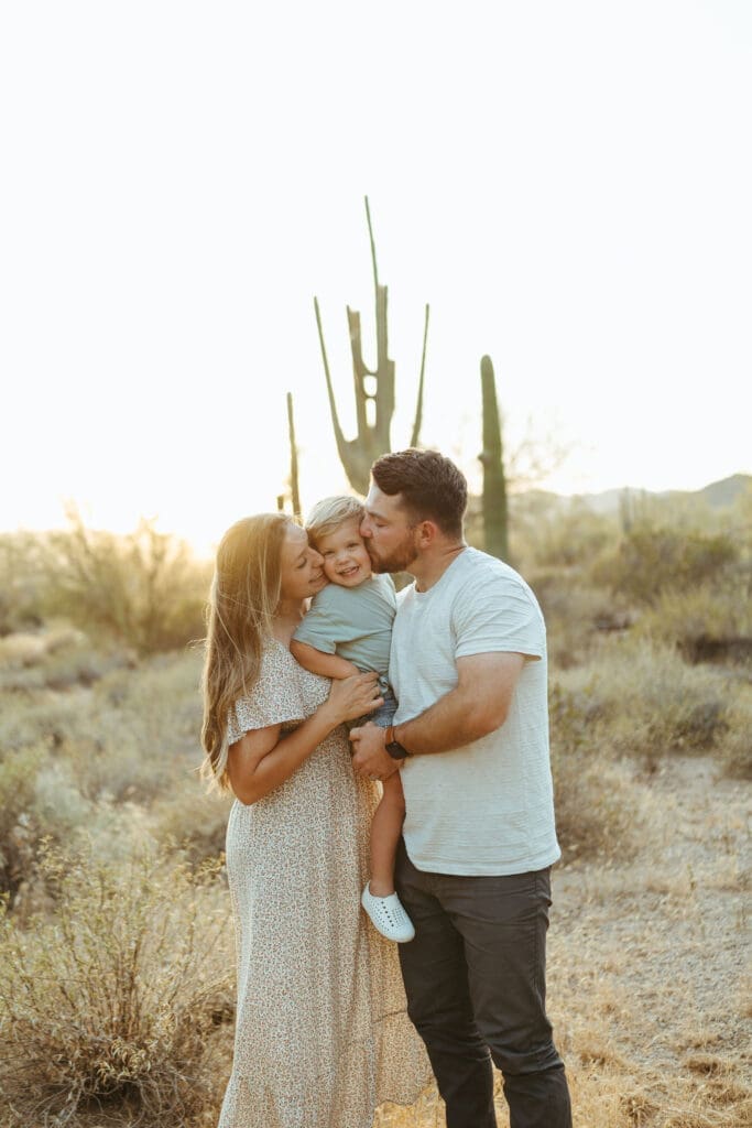 Family pregnancy announcement session near the Superstition Mountains during golden hour in Apache Junction Arizona