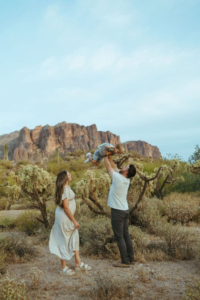 Gilbert Arizona family photographer capturing emotional maternity and family moments outdoors