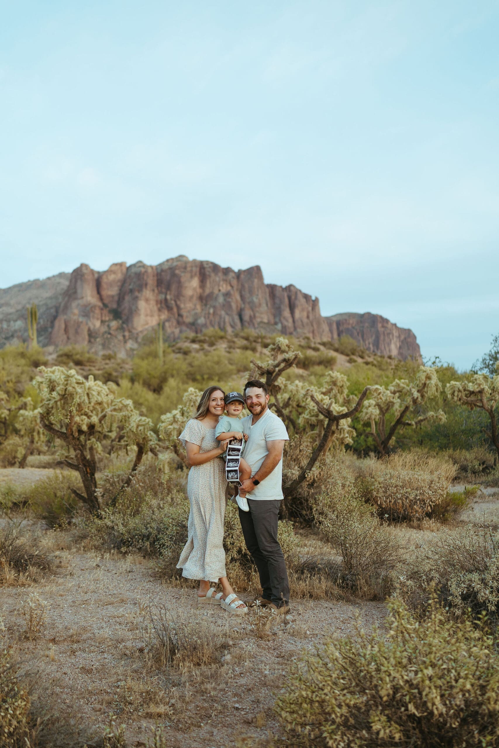 Family pregnancy announcement session in the Superstition Mountains near Apache Junction Arizona at sunset