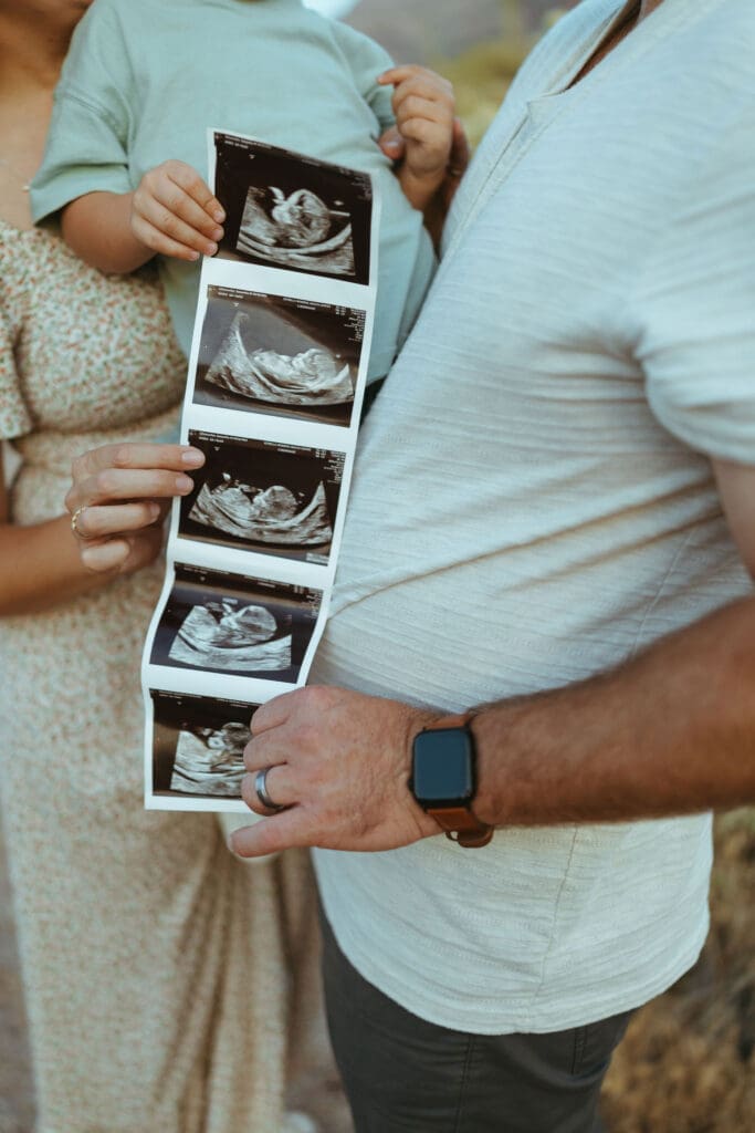 East Valley Arizona family photographer capturing authentic pregnancy announcement photos outdoors