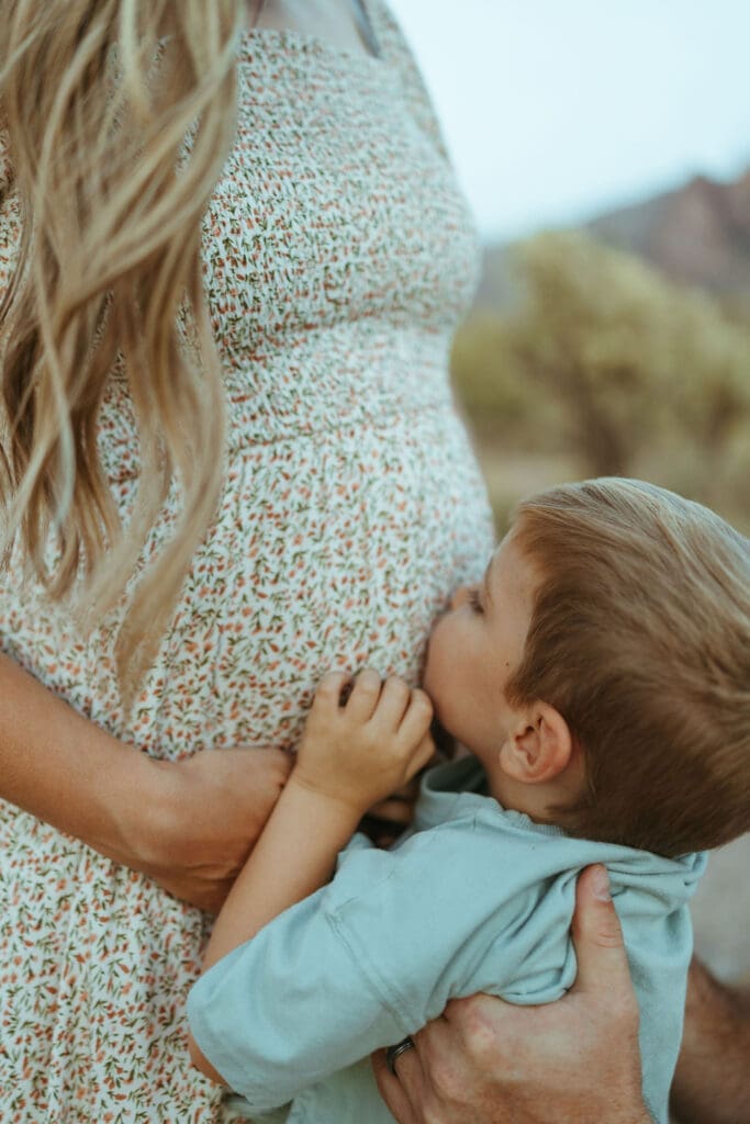 Phoenix maternity photographer capturing natural family connection in the Arizona desert near Mesa Arizona