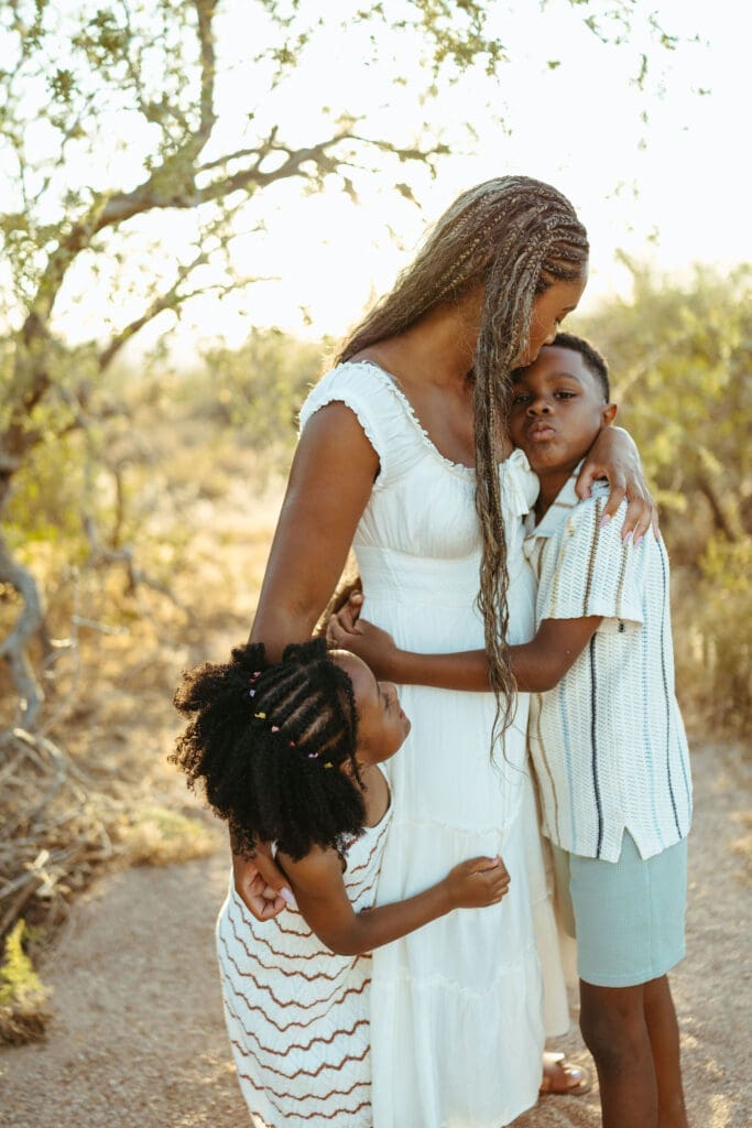 Young boy hugging his mother during a candid family photography session near Lost Dutchman State Park