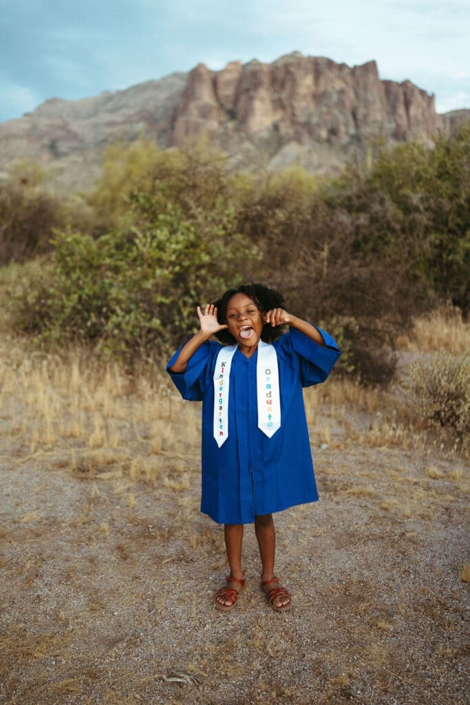 Kindergarten graduation portrait with mountain views near Lost Dutchman State Park