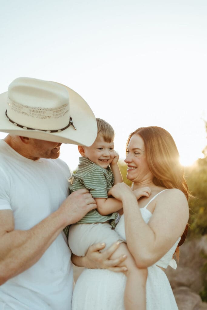 Joyful family maternity photos at Phon D Sutton Recreation Area along the Salt River near Phoenix, Arizona.