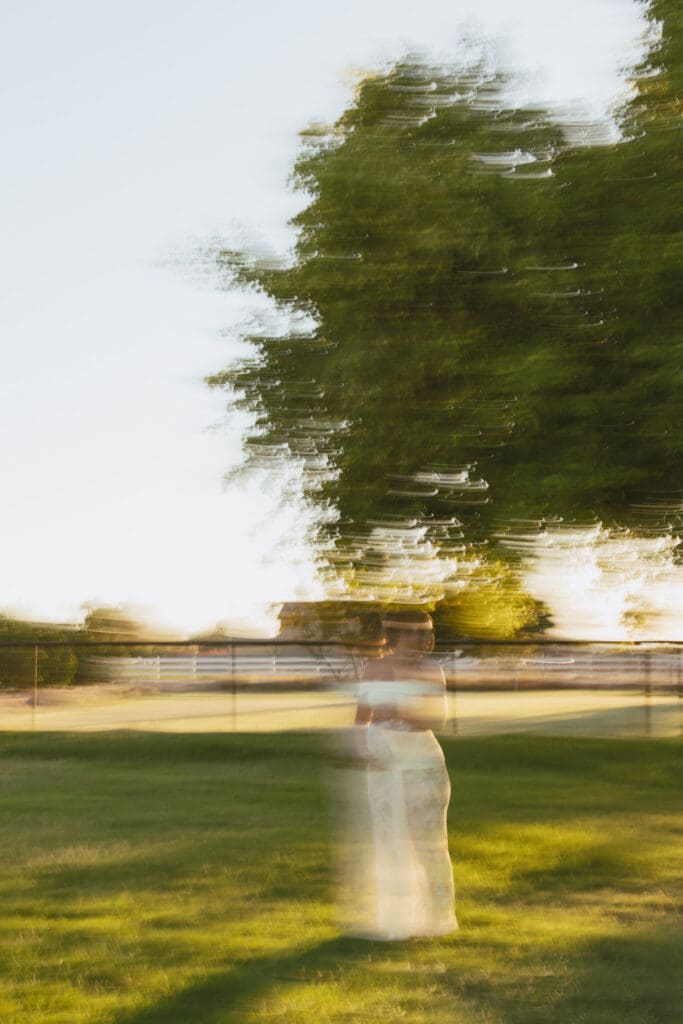 Artistic motion blur maternity portrait in an open field at Patch of Paradise AZ near Gilbert.