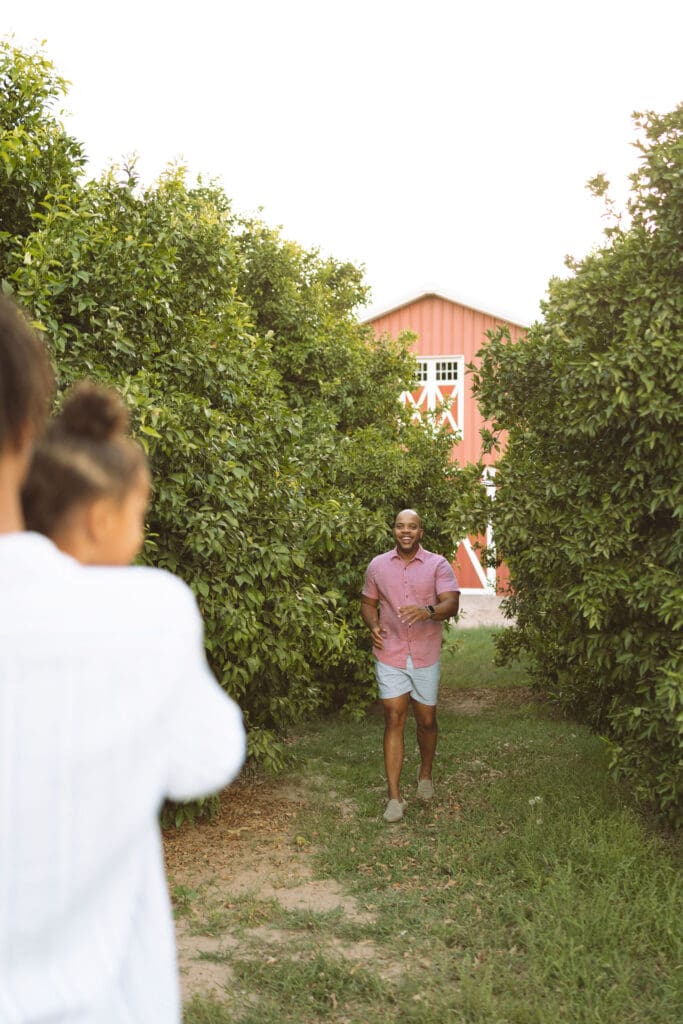 Behind-the-scenes moment during a family photo session at Hagen Farms in Queen Creek, Arizona.