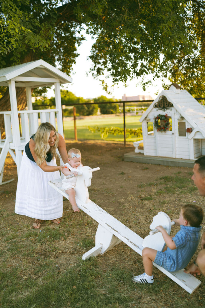 Toddler meeting a friendly duck during a fun outdoor family photography session with young children in Gilbert, Arizona.
