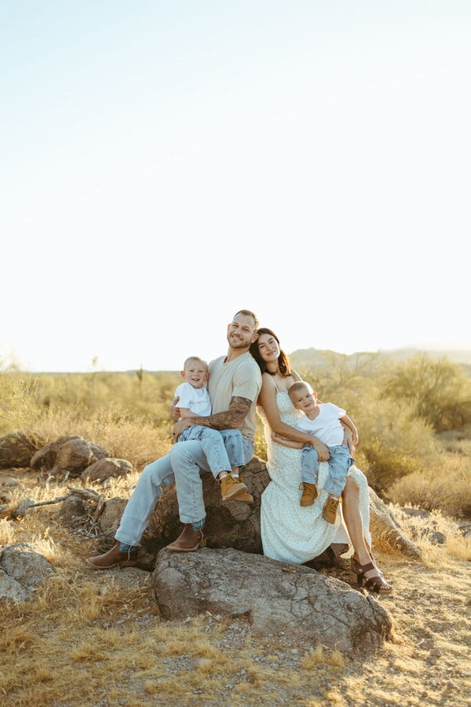Family portrait at the Superstition Mountains with golden sunset during a Scottsdale maternity session