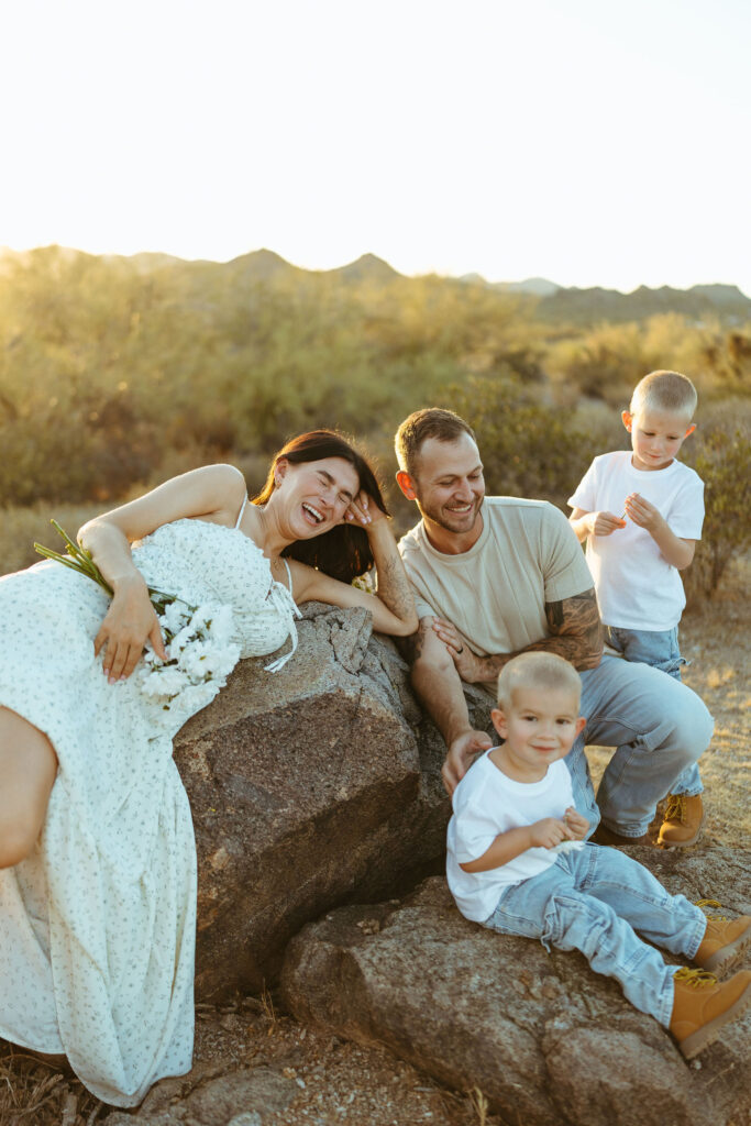 Relaxed family maternity session with parents and two boys at the Superstition Mountains