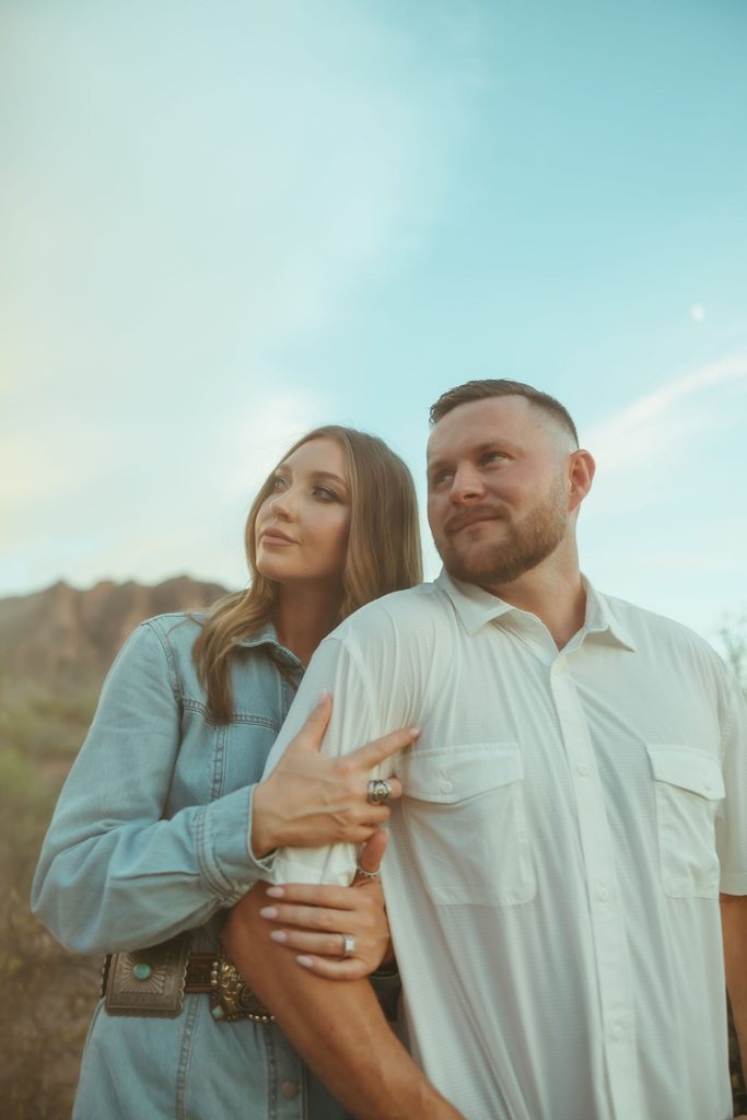 Scottsdale engagement photographer capturing a close-up portrait of an engaged couple against the rugged Superstition Mountains in Arizona.