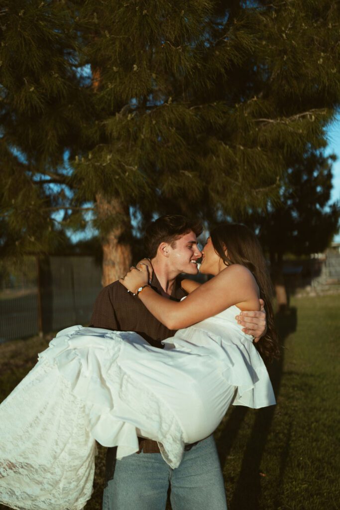 Couple sharing a romantic moment during golden hour couples photography at The Cozy Acre in Gilbert, Arizona