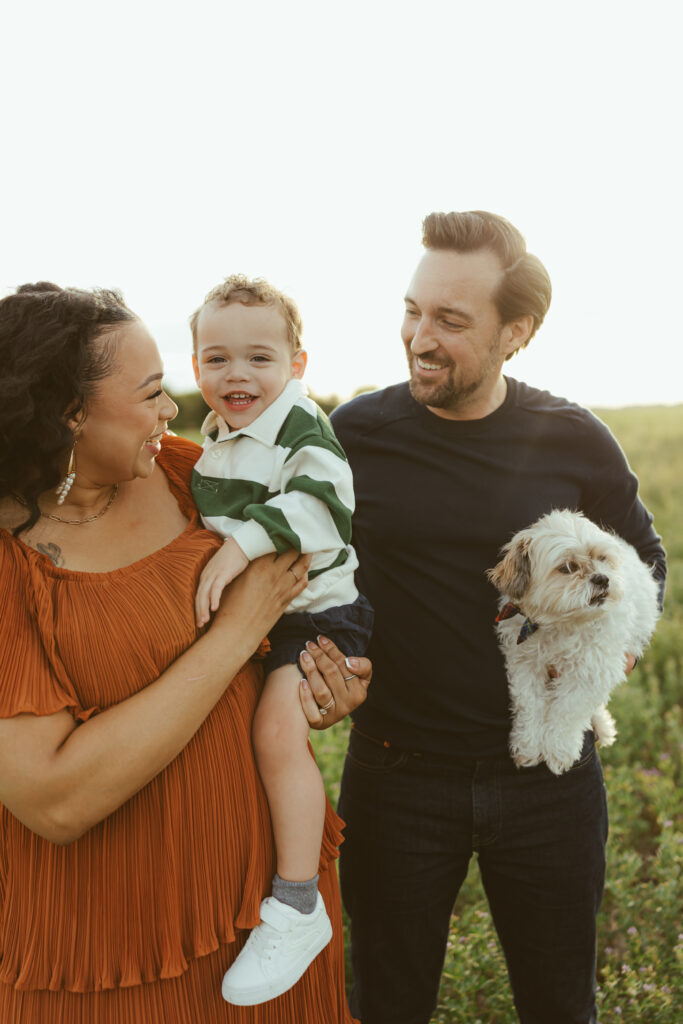 Family of three with their dog during an outdoor family photography session in Queen Creek, Arizona